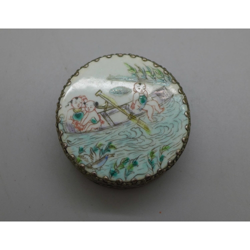 966 - An oriental white metal circular box with river scene, diameter 55mm