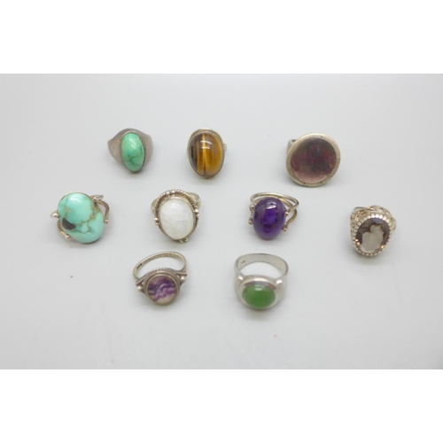 969 - Nine silver rings including Blue John, tigers eye and turquoise