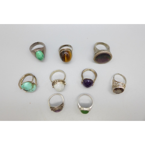 969 - Nine silver rings including Blue John, tigers eye and turquoise