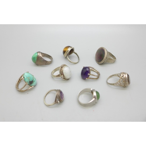 969 - Nine silver rings including Blue John, tigers eye and turquoise