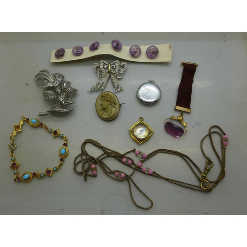 973 - Costume jewellery, amethyst quartz buttons, a compass fob and a watch fob