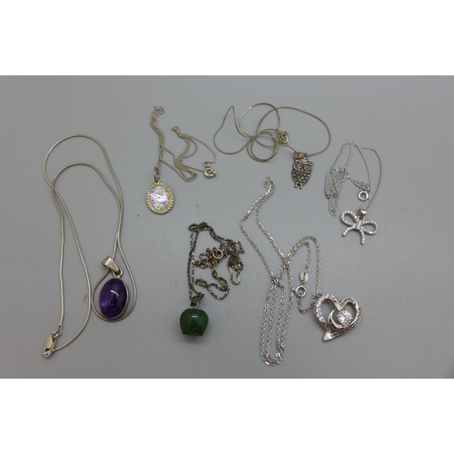 979 - Twenty silver pendants and chains