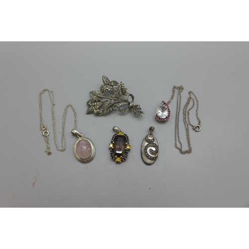 983 - Four silver pendants and a brooch lacking pin