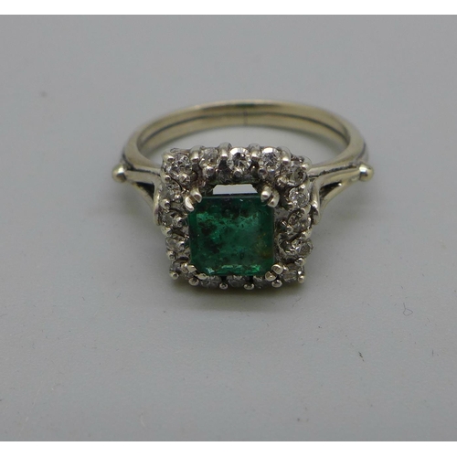 989 - A white metal set, emerald and diamond ring, 3.5g, M