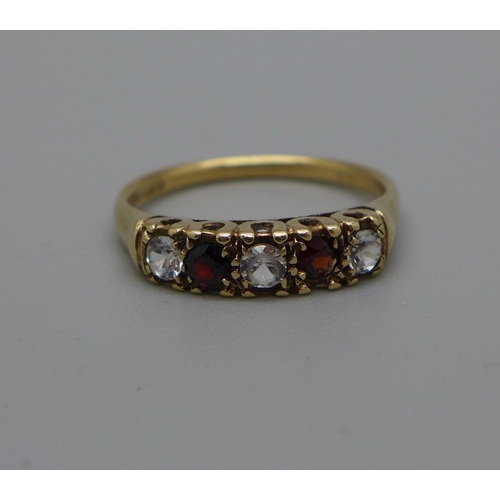 993 - A 9ct gold, garnet and white stone ring, 2.6g, S