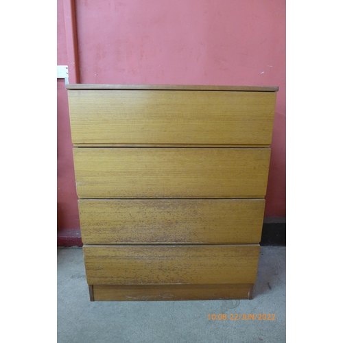 106 - A teak chest of drawers and a teak and tiled topped nest of tables