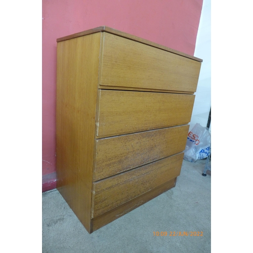 106 - A teak chest of drawers and a teak and tiled topped nest of tables