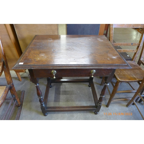 180 - A George II oak single drawer side table