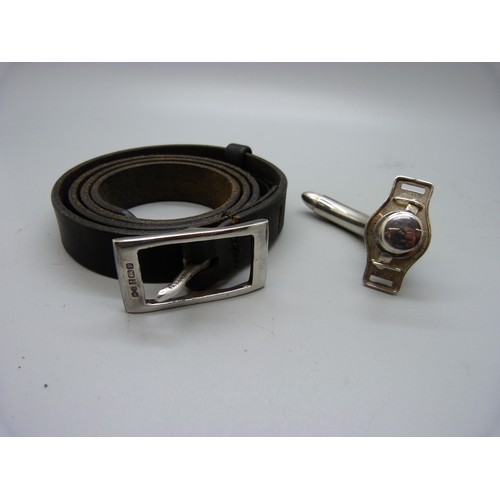 879 - A hallmarked silver buckle on a leather belt, 28mm, and a tracheostomy tube