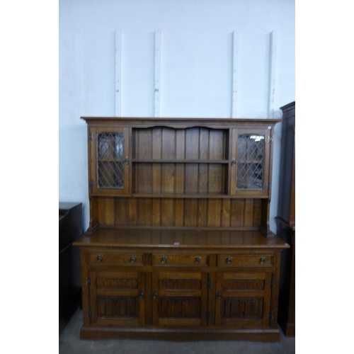 196 - A carved oak dresser