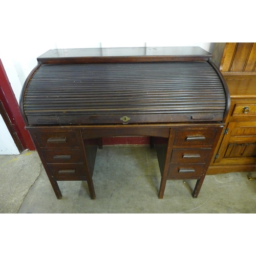 197 - An early 20th Century oak tambour roll top desk