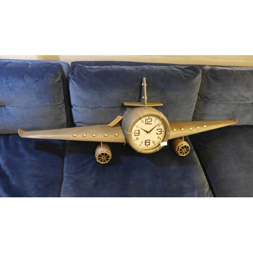 1328 - An aeroplane style wall clock with a wing span of 143cms (PHLL31049)   #