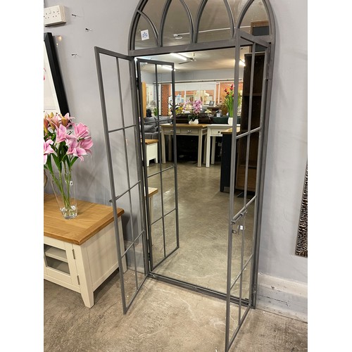 1400 - A large grey iron mirror in the style of an opening arched window, H 180cms (MP1897)   #