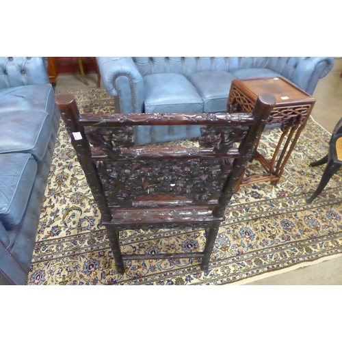 1 - A late 19th/early 20th Century Chinese carved padouk wood elbow chair