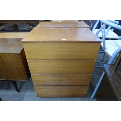 106 - A teak chest of drawers and a teak and tiled topped nest of tables