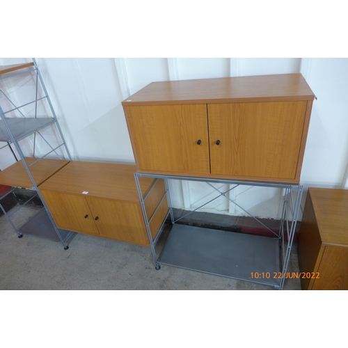 108a - A teak and grey metal wall unit