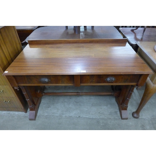 109 - A Victorian mahogany two drawer writing table