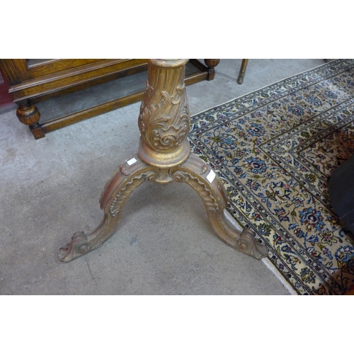 11 - An Italian carved giltwood floor standing downlighter lamp