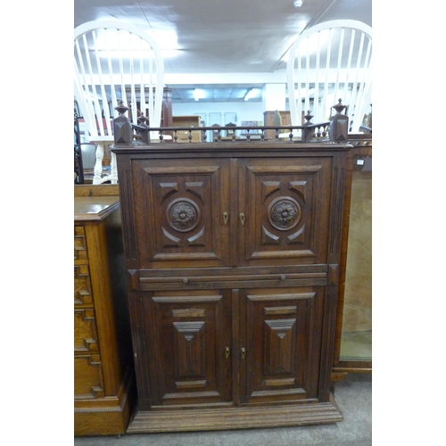 113 - A 19th Century French Breton carved oak four door housekeepers cupboard