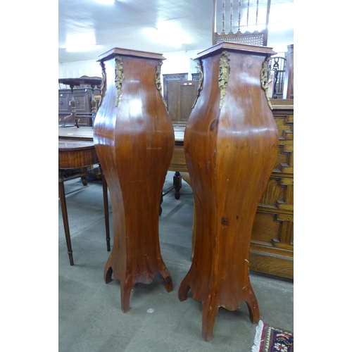 116 - A pair of French style beech and gilt mounted pedestals