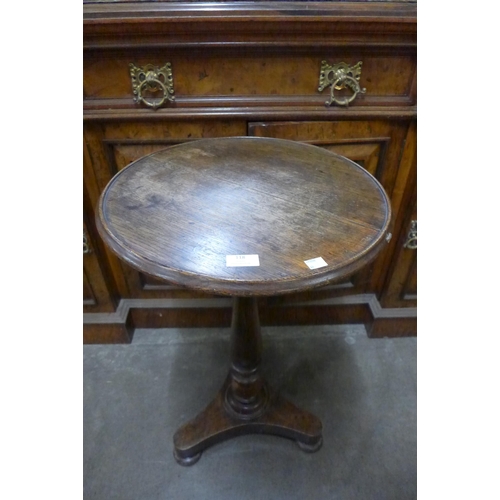 118 - A Victorian oak circular tripod lamp table