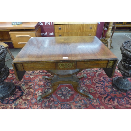 12 - A Regency rosewood and brass inlaid sofa table