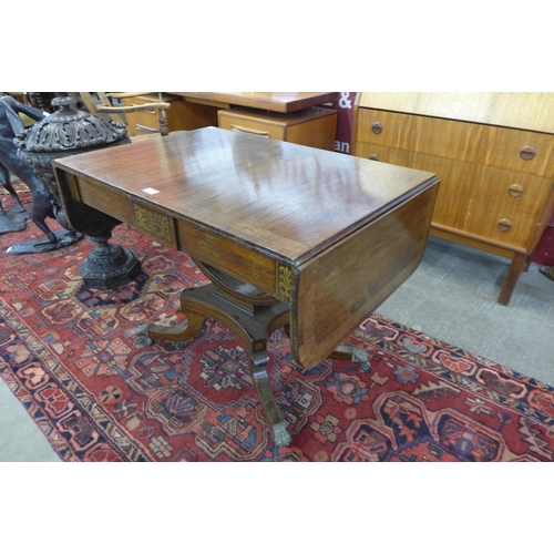 12 - A Regency rosewood and brass inlaid sofa table