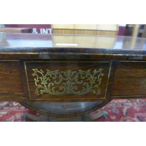 12 - A Regency rosewood and brass inlaid sofa table