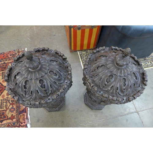 13 - A pair of large Italian style bronze campana shaped urns and covers, cast with Bacchanalian cherubs