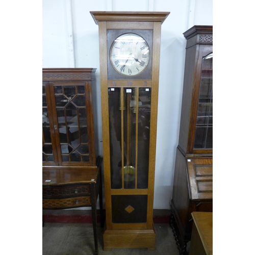 130a - An early 20th Century oak triple weight longcase clock with GWR inlaid lettering