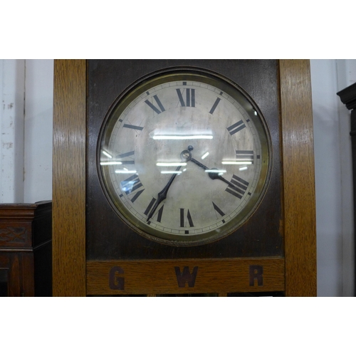 130a - An early 20th Century oak triple weight longcase clock with GWR inlaid lettering