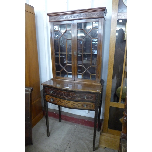 131 - An Edward VII Chippendale Revival mahogany side cabinet, with carved blind fret decoration