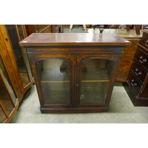 138 - A small Victorian walnut two door bookcase