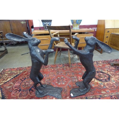 14 - A pair of large bronze figures of boxing hares