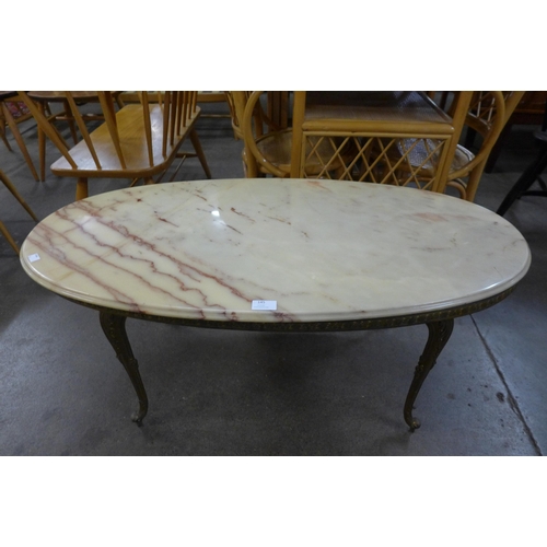 145 - A French brass and onyx oval coffee table