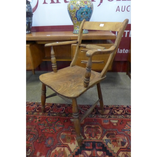 15 - A Victorian elm and beech kitchen elbow chair