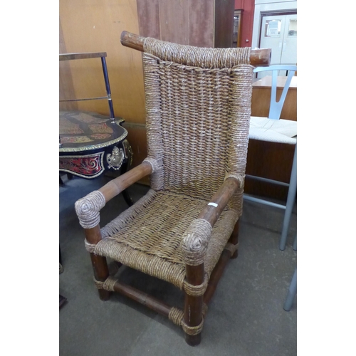 166 - An Indian bamboo and cane armchair