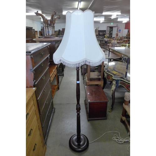 168 - A mahogany standard lamp