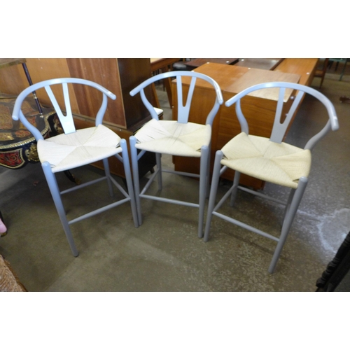 169 - A set of three Hans Wagner style painted beech stools