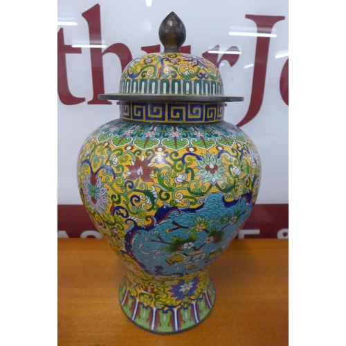 17 - An oriental champleve enamelled vase and cover