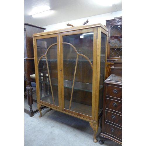 178 - A walnut two door display cabinet