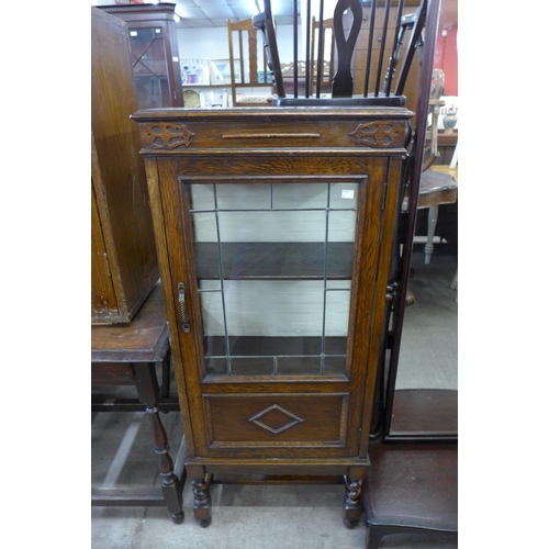 182 - An early 20th Century oak single door bookcase