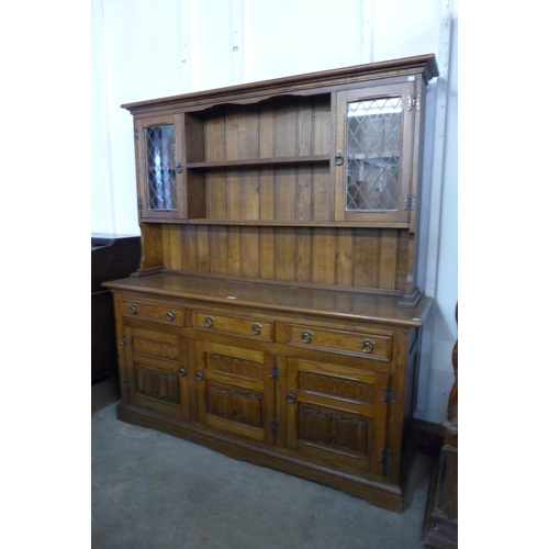 196 - A carved oak dresser