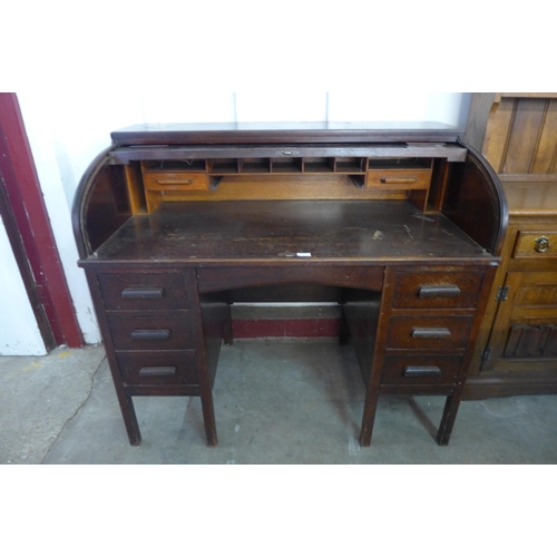 197 - An early 20th Century oak tambour roll top desk