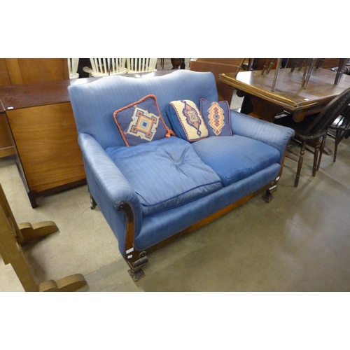 208 - A Victorian mahogany and blue fabric upholstered scroll arm settee