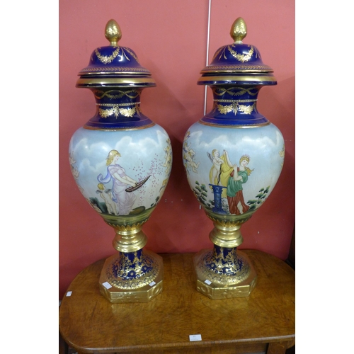 21 - A pair of large Vienna style porcelain vases and covers