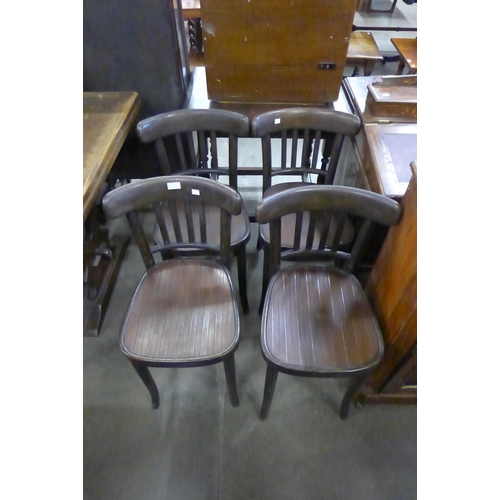 211 - A set of four beech bentwood chairs