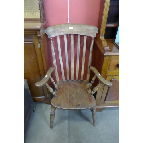 25 - A Victorian elm and beech farmhouse armchair