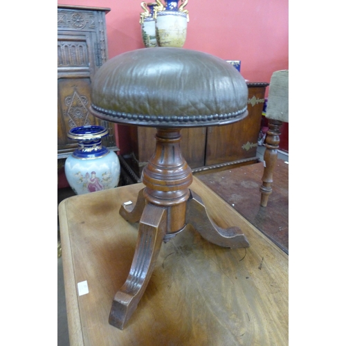 26 - A Victorian walnut revolving piano stool, stamped Woolley & Co., Sellers, Nottingham