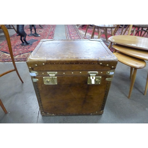 29 - A brown leather and brass mounted trunk